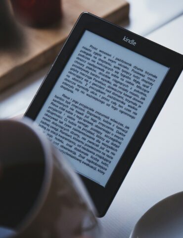 turned on black Amazon Kindle e-book reader