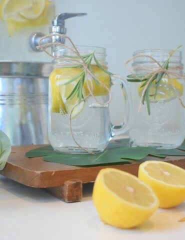 a couple of lemons sitting on top of a cutting board